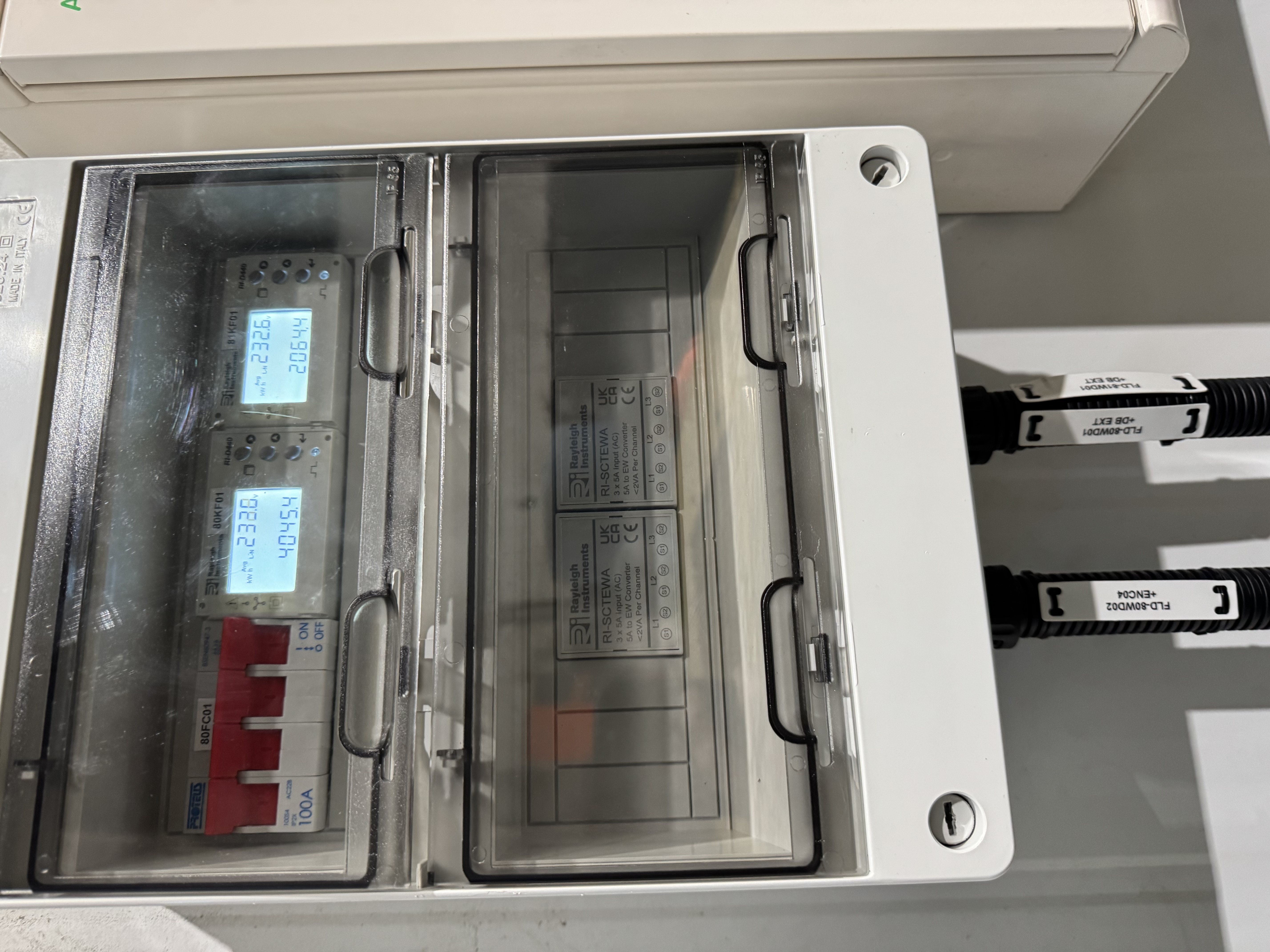TYPE: photograph
CONTENT: This image displays an electric meter enclosure,
